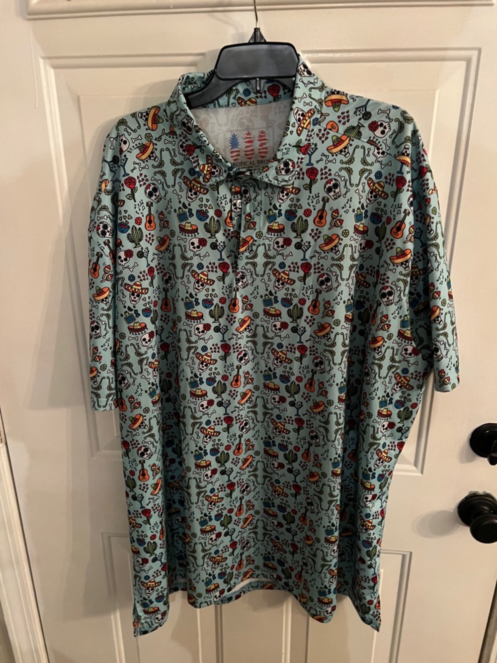 Men's Light Teal Short-Sleeve Polo with Festive Multicolor Print